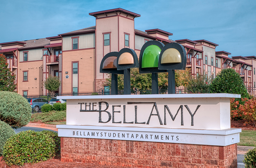 The sign saying The Bellamy with the apartments in the background